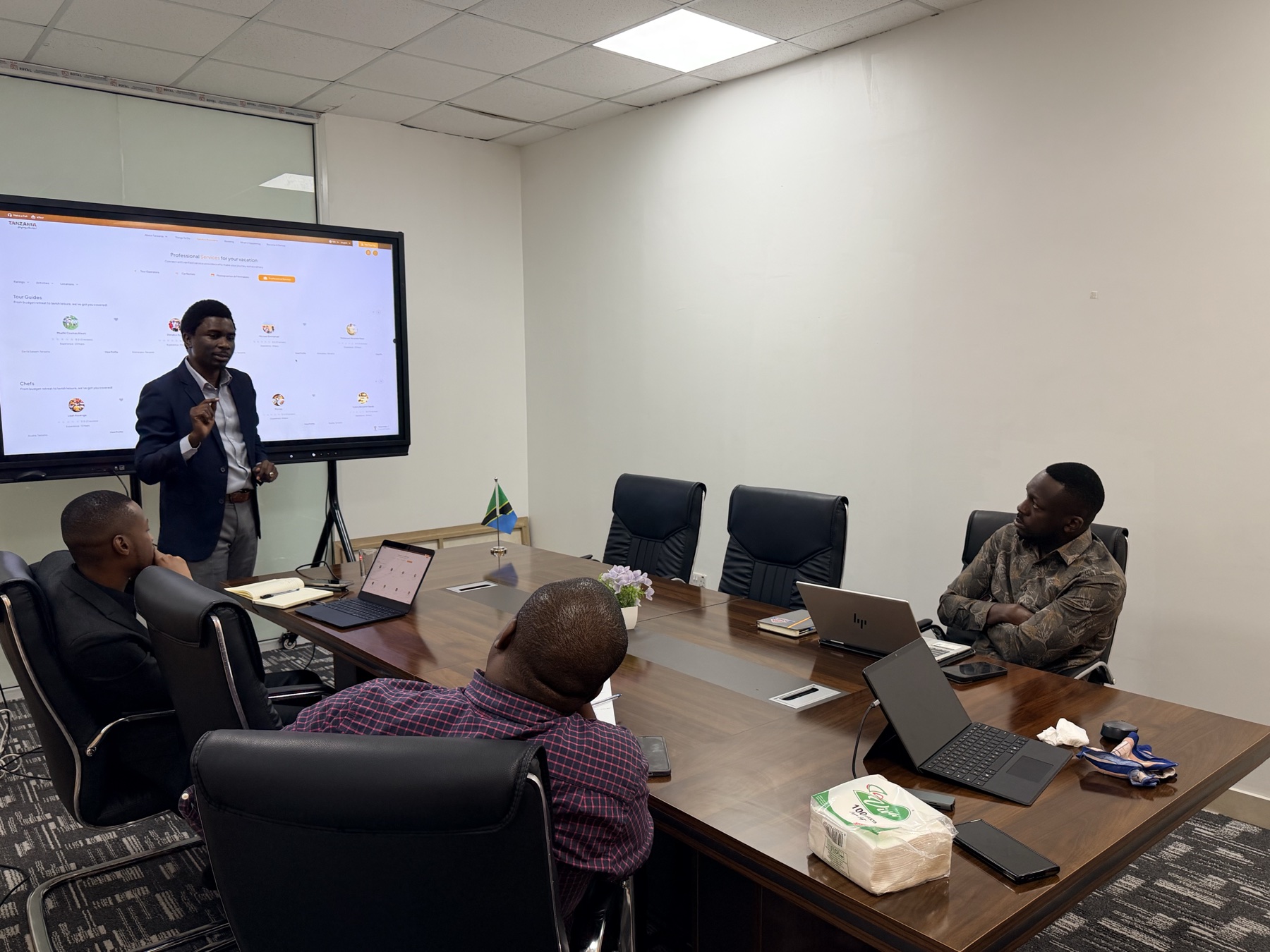 Team members listening during an office presentation