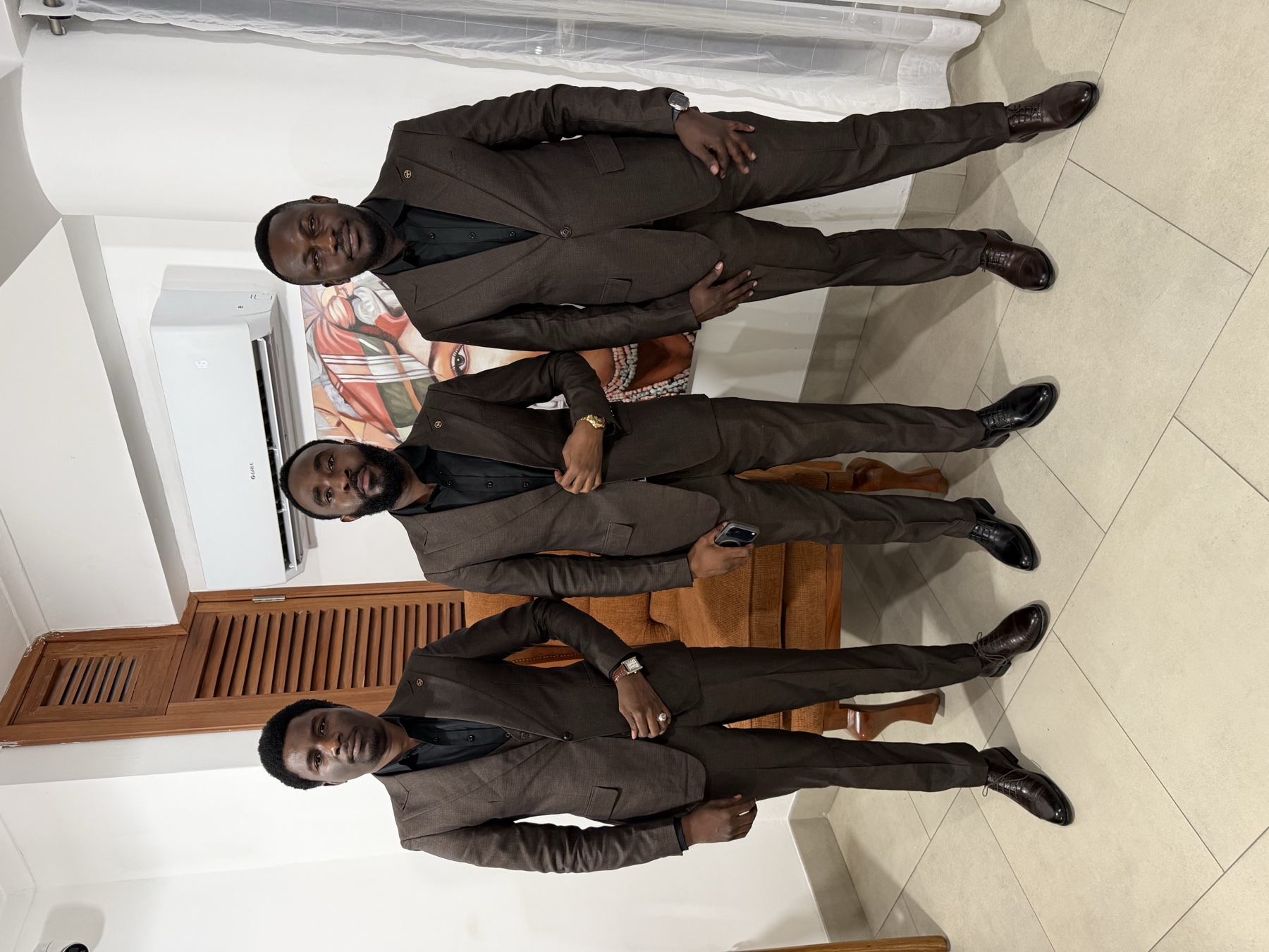 Three BISMIN team members in coordinated formal attire